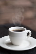 An espresso cup filled with coffee