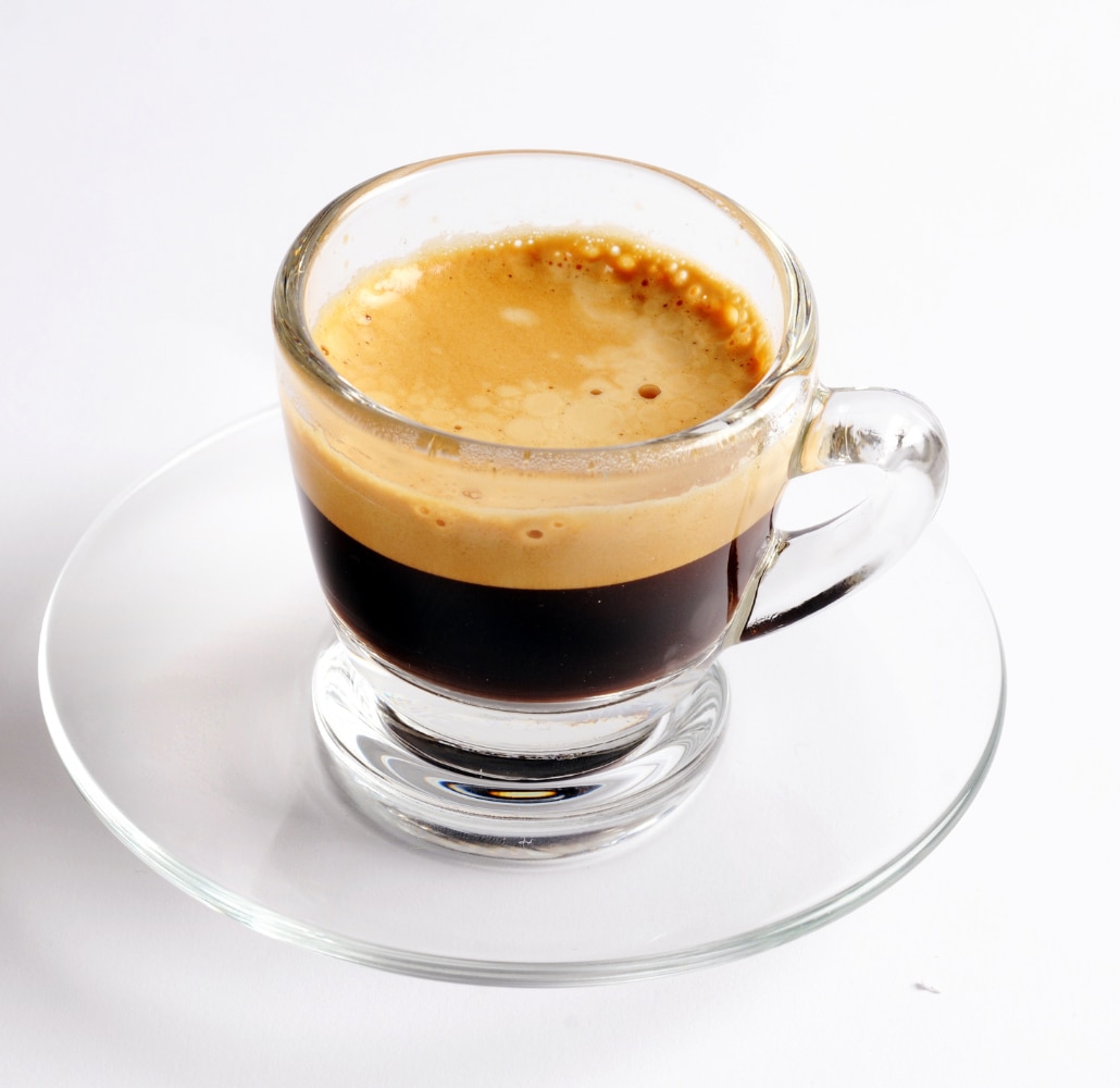 An espresso cup filled with coffee